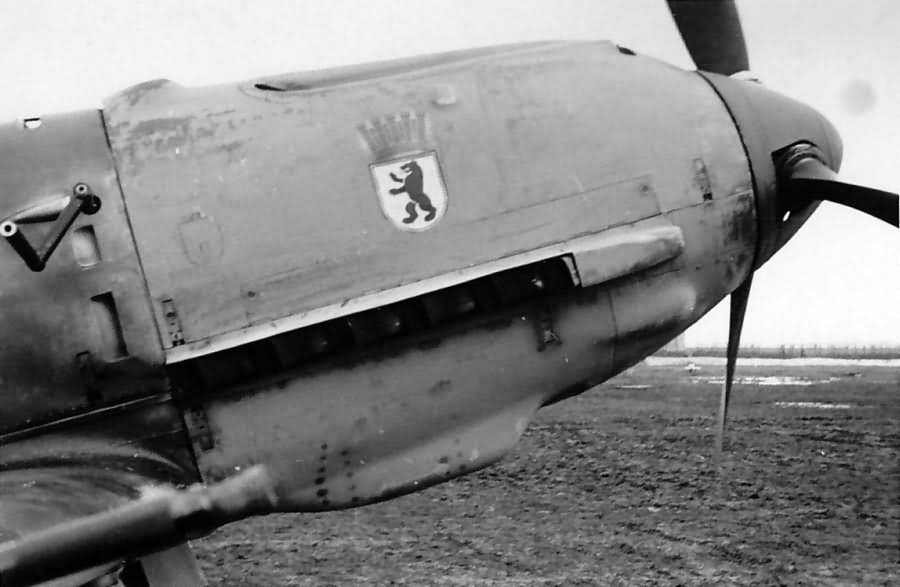 Bf_109_E_II.JG_27_with_Gruppenwappen_1941.jpg
